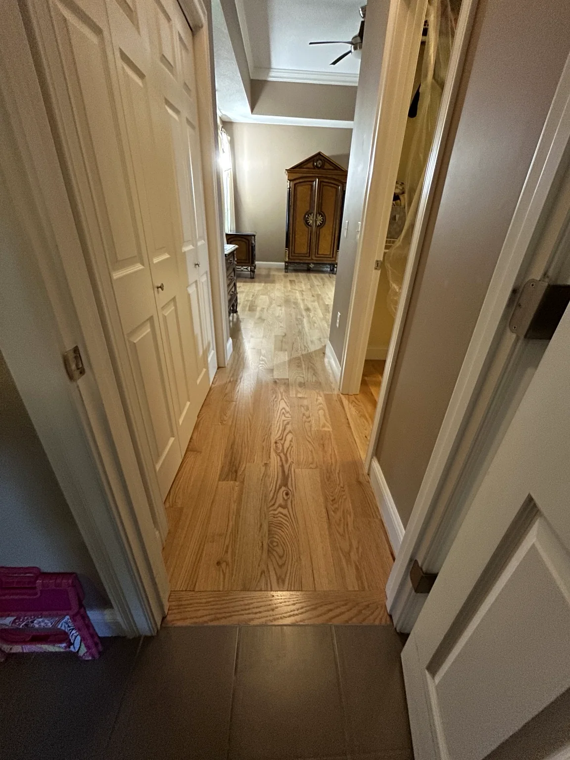 Hallway with finished hardwood flooring