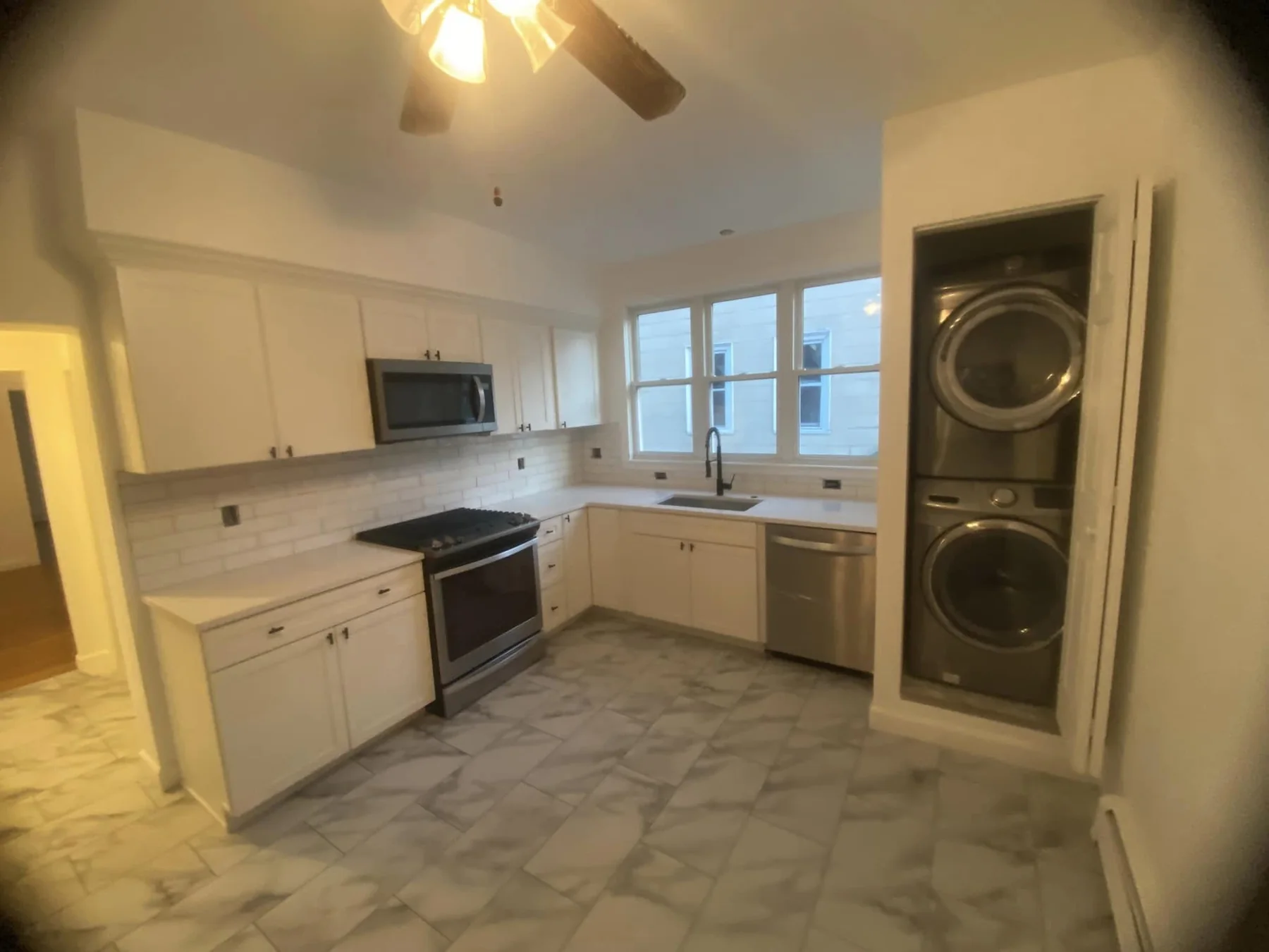 Bright renovated kitchen with white cabinetry